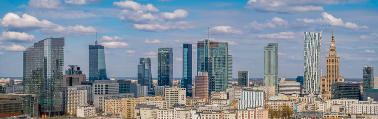 Warsaw city center under blue cloudy sky aerial landscape
