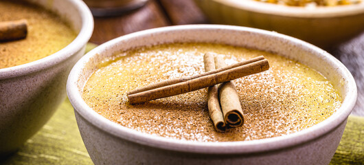 cinnamon stick decorating typical Brazilian corn cream called curau, typical food of the June festivities