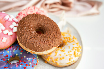 Fresh sweet donuts in colorful glaze