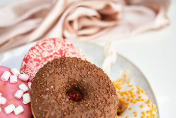 Fresh sweet donuts in colorful glaze