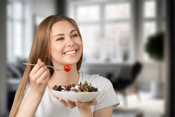 Diet concept, young woman eat vegetables salad