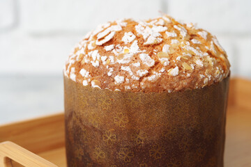 Easter cake with sugar powder on gray background