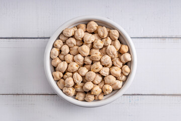 Chick pea uncooked beens. Studio shoot on light background. Up view shoot.