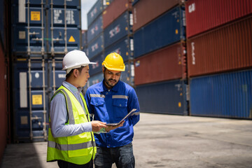 Engineer manager and foreman using laptop computer control or check inventory details of containers box, worker checking quantity of product in containers.