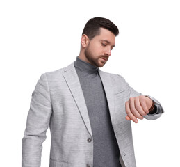 Naklejka premium Handsome bearded businessman checking time on white background