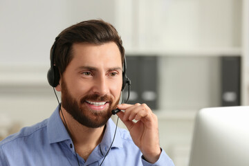 Hotline operator with headset working in office, space for text