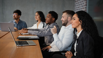 Diverse multiracial office workers multiethnic partners employees investors team watching...