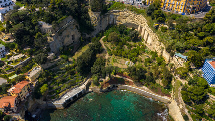 Fototapeta na wymiar Aerial view of Marechiaro gulf. It is located in the Posillipo district in Naples, Italy. It is a small artificial gulf of the Tyrrhenian Sea.