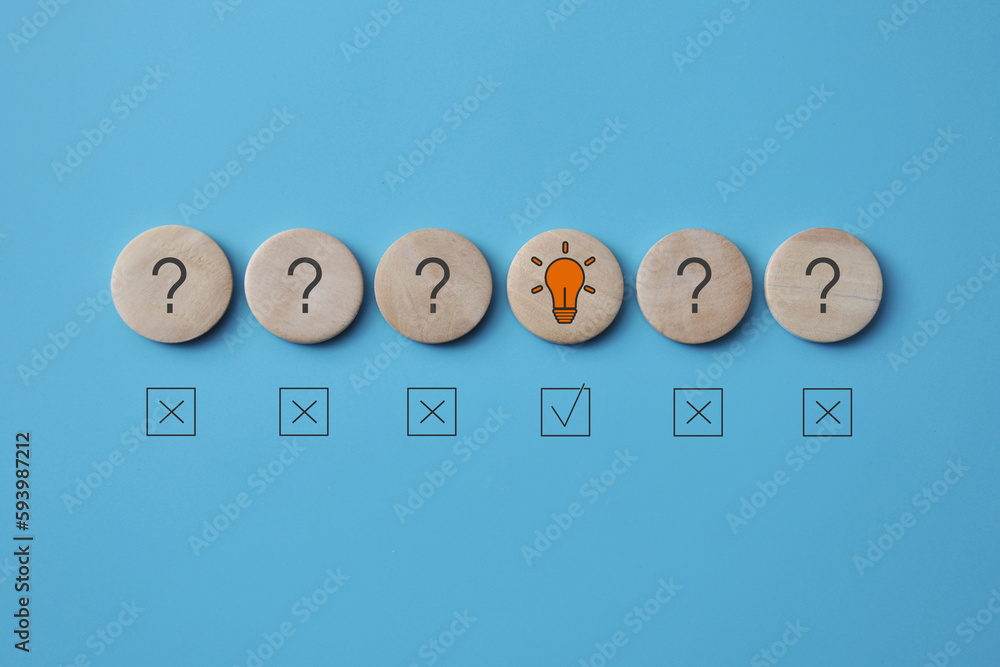 Poster questions and a light bulb on the mugs. choosing a creative method for solving problems
