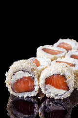 sushi roll with sesame salmon and Philadelphia cheese