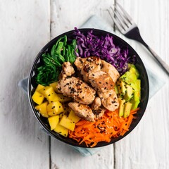 Fresh chicken poke salad bowl served in white tabletop 	