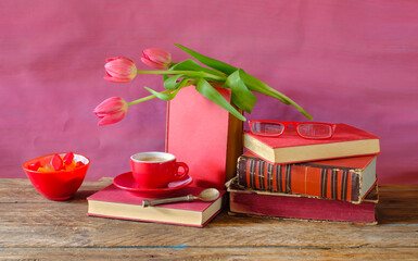 stack of books, espresso coffee and tulips, reading and education in the springtime - 593989838