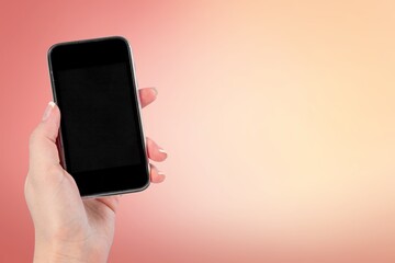 Hand holding phone with a blank screen