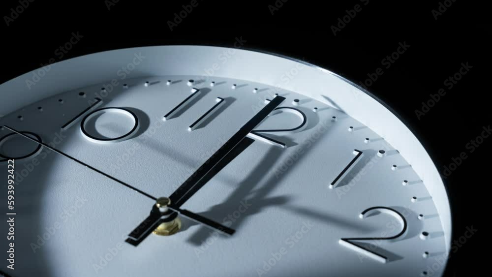Poster closeup of passing analog clock with fast time isolated on black background