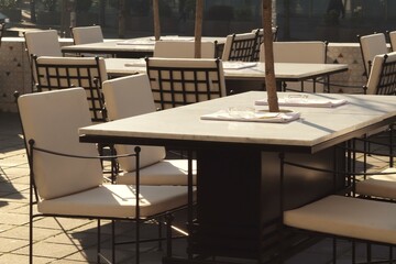 Outdoor cafe tables on a cool morning