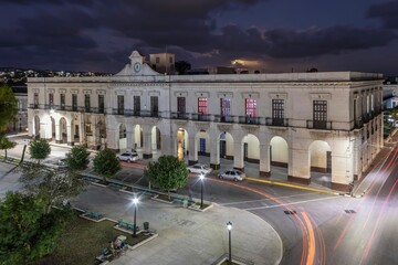 Aerial shot of government building in La Libertad de Noche Park in the evening, Matanzas, Cuba