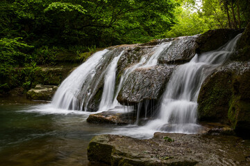 Fototapeta na wymiar Spring waterfall in La Garrotxa, Girona, Spain