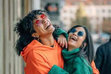 friends on the street laughing out loud