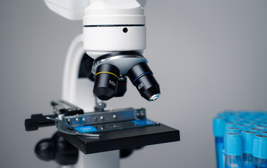 Science laboratory research and development concept. microscope with test tubes.