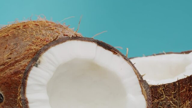 coconut coco rotating, coco oil, lemonade fresh fruits falling splashing into water aquarium or pot, splash healthy food diet freshness concept 