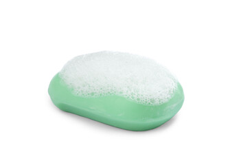 Soap bar with fluffy foam on white background