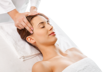 Beautiful young woman relaxing with hand massage at beauty spa