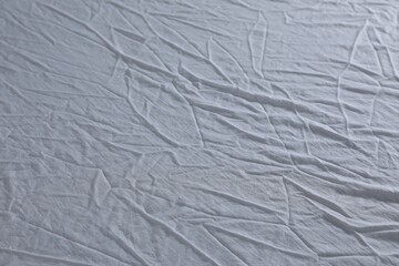 Crumpled white fabric as background, closeup view