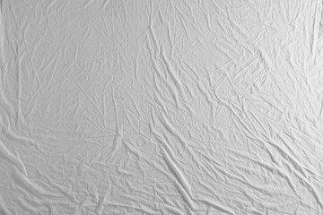 Crumpled white fabric as background, top view