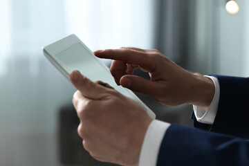 Closeup view of man using new tablet indoors
