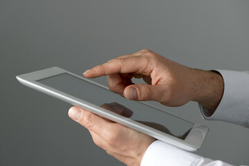 Closeup view of man using new tablet indoors