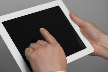 Closeup view of man using new tablet indoors