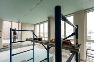 Repairman Repairing Ceiling, Ceiling panels broken and damage from water leakage ,Home maintenance and repair home concept.