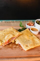 A vertical shot of a pastel with ham and cheese