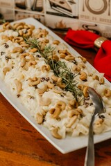 A vertical shot of a salad with cashews