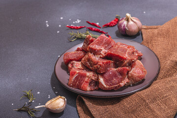 Raw pork loin pieces with ground spices. Marinated meat cuts, ingredient for cooking healthy food