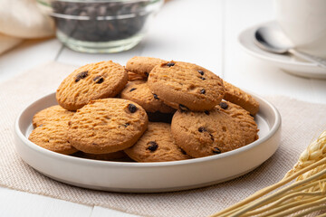Pile of Chocolate Chip Cookies on a White Plate