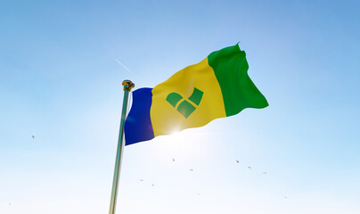 Flag of Saint Vincent waving in the wind, sky and sun background. St Vincent and the Grenadines flag. 3D rendering realistic waving flag background. 