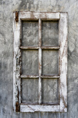 Old wooden frame from a window on a plastered wall