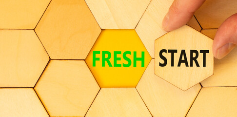 Fresh start and motivational symbol. Concept words Fresh start on wooden puzzles. Beautiful yellow...