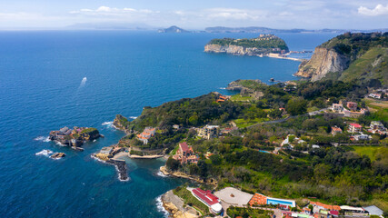 Aerial view of the island of Nisida and Cape Posillipo which are located in Naples, Italy. Nisida is a volcanic islet of the Flegrean Islands archipelago - obrazy, fototapety, plakaty