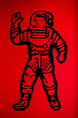 The image of an astronaut on a red background