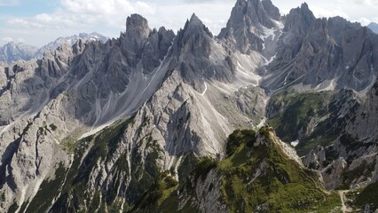 Fototapeta na wymiar Cadini di Misurina, also known as the Towers of Mordor, is a mountain range in the Dolomites, Italy. Many people come to this exact location to Instagram it.
