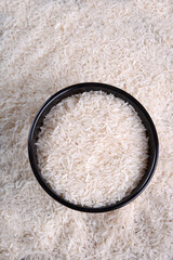 white rice natural long rice grain on wooden table use texture background
