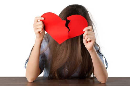 Woman Holding Broken Heart-Shaped Paper