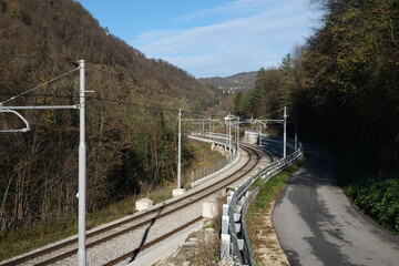 Railroad winding in valley between mountains