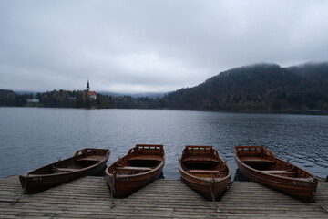 Fototapeta premium Four boats moored on pier