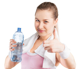 Young woman drinking water after work out