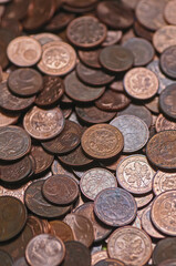 Close up of a pile of old coins. Shallow depth of field.