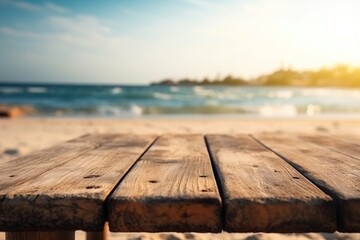 Naklejka na ściany i meble a wooden table sitting on top of a sandy beach next to the ocean with a view of the ocean in the distance in the background. generative ai