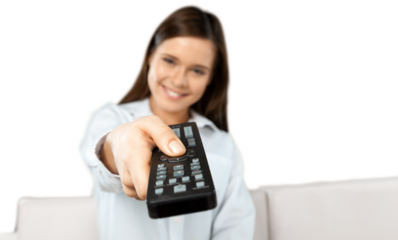 Woman holding remote controller and smiling on white